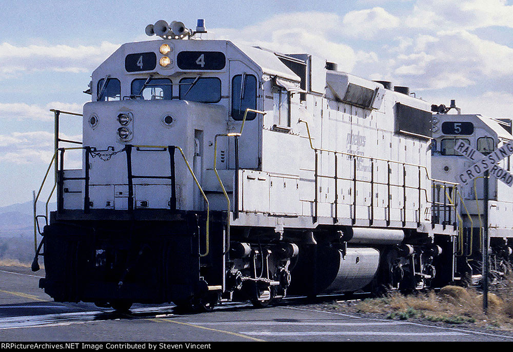 Phelps Dodge Hidalgo Division GP38-2 #4 crosses Hwy 113 NB near the continental divide